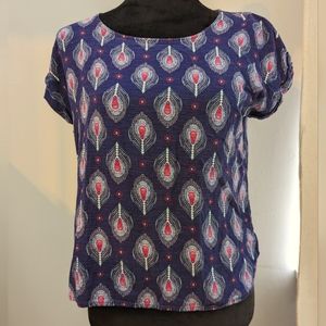 Colorful zip-up  t-shirt with blue and pink peacock pattern by Pink Republic.